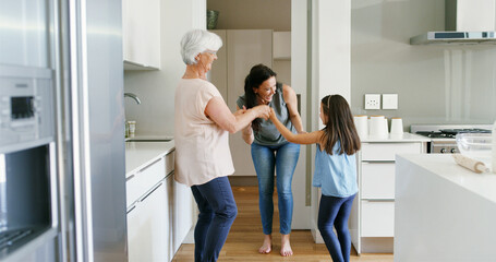 Mother, child and grandmother with dancing in home for celebration, bonding or security. Energy, women or girl kid in circle in kitchen with moving together for weekend entertainment, care or support