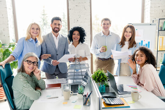 Professional team collaborating in modern office space with daylight