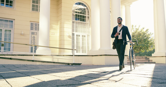 Happy, businessman and walking with bicycle for morning commute, travel or transport to work in city. Man, employee or traveler with smile, coffee or bike for local business or eco friendly ride