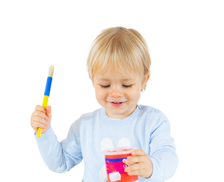 Playful blond child boy painting isolated over transparent background. PNG transparent. - Powered by Adobe
