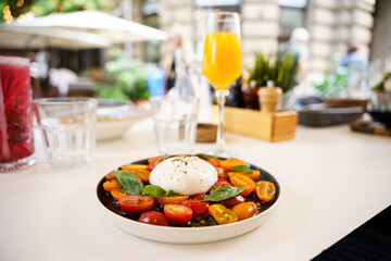 Burrata with cherry tomatoes and fresh basil