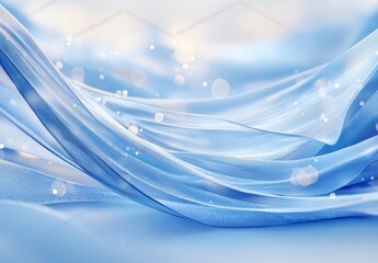 Abstract image of flowing blue fabric with soft lighting and bokeh effects. The fabric creates waves and curves across a light blue background