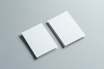 Two stacks of blank white paper cards on gray background.