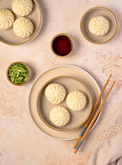 Food photography of steamed duck bao buns, spring onion,  soy sauce, Chinese dumplings, Asian cuisine, meat stuffed buns, savory pastry