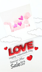A banner for Valentine s Day sale with a white envelope with little hearts coming out of it along with the word Love