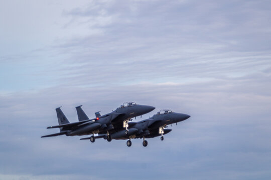 Two F15 fighter jets with landing gear down coming in to land at RAF Lakenheath