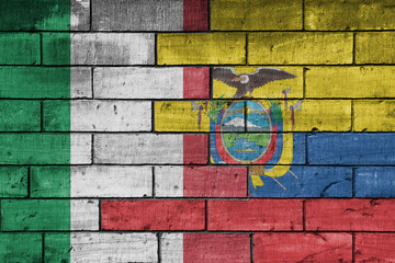 colourful painted big flag of italy and flag of ecuador on a massive old brick wall background....