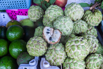 Close-up shot of green custard apples, in a grocery store in Little India, Singapore. They are also known as sugar apples or sweet sop. They are popular for their many health benefits.