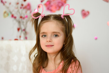little girl with a valentine's day heart