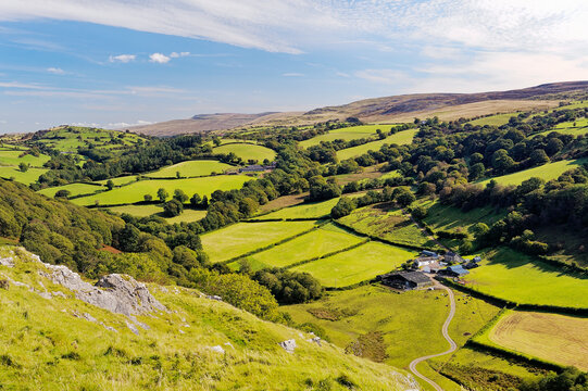 Looking east from Carreg Cennen castle up hill farm farmland toward the Black Mountain, Wales, UK. Brecon Beacons National Park