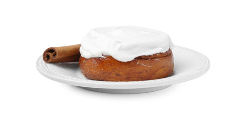 Tasty cinnamon roll with cream and stick isolated on white