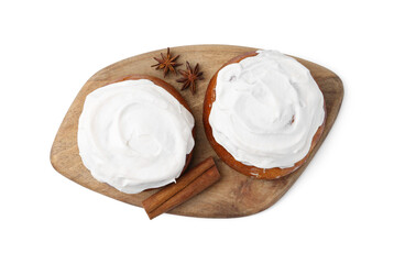 Tasty cinnamon rolls with cream and spices isolated on white, top view