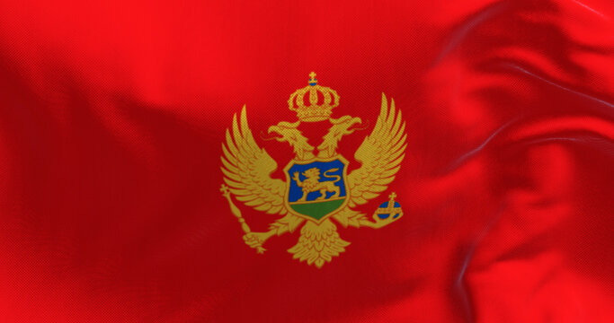 National flags of Montenegro waving in the wind on a clear day