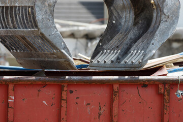 Construction crew dismantles primary school building showcasing remnants of student memories