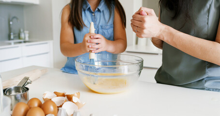 Mother, girl and hands for baking stir in home, teaching child and support with pastry recipe....