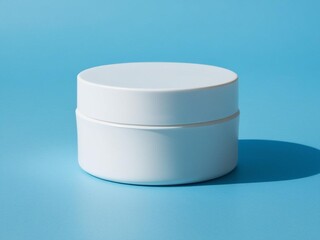 blank white skincare jar on blue background