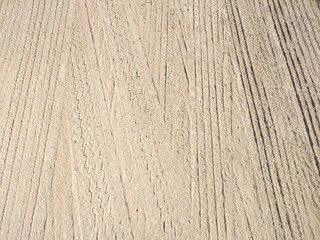 Photo of tire marks on the ground with space for text to use in your project.