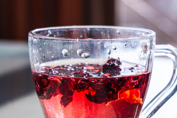 Red Hibiscus tea in the cup. Karkade tea for ramadan celebrations 