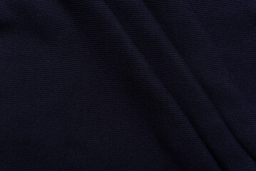 Fototapeta premium Background texture of dark blue woven fabric for wear made of soft cotton.
