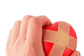heart figurine in hand on white background