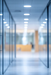 Bright and modern office hallway with glass walls and tiled floor reflecting natural light from large windows bright, modern hallway with large windows.
