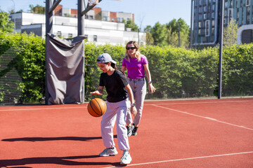 Together is better. Family playing basketball together. 
