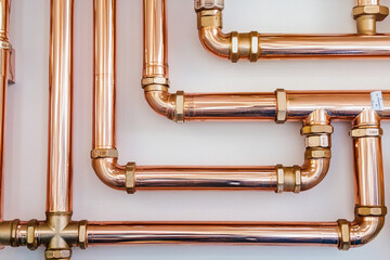 Copper plumbing pipes arranged for installation in building