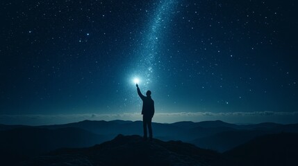 Fototapeta premium A man pointed a flashlight upward into the night sky.