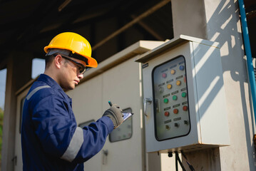 A plumbing engineer is inspecting the operation of a high-pressure water pump system in an...