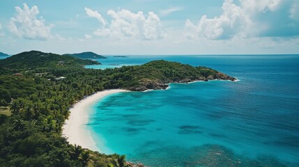Fototapeta premium Aerial footage of a tropical island with turquoise waters, white sandy beaches, and lush palm trees