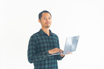 Bearded man wearing flannel is holding laptop and smile on isolated white background