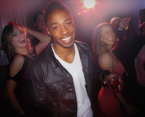 African man, club and night celebration in portrait, dancefloor and confidence for dancing at...