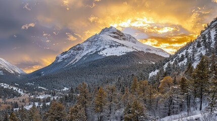 Majestic sunset over snow-covered mountains in a serene valley with evergreen trees