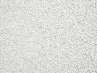 Fototapeta premium Clean white plaster texture; ideal background for fashion photography and minimalist mockups.