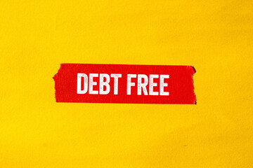 Obraz premium Debt free message written on ripped torn red paper tape on yellow background. Conceptual debt free symbol. Copy space.