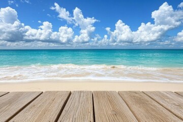 Fototapeta premium Beautiful turquoise ocean meets bright blue sky with fluffy clouds near sandy beach in daytime