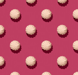 Pink soft marshmallow on pinky background, zephyr on a pink background. Zephyr Pattern with hard shadow
