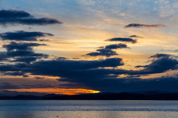Serene Sunset Over Vancouver Island Coastline with Tranquil Sky