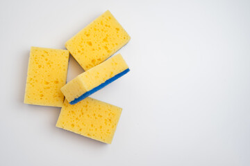 Colored sponges for washing dishes. Kitchen sponge on a light background.
