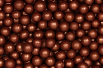 Shiny Bronze Sugar Pearls – Metallic Edible Sprinkles for Cake, Cupcake, and Dessert Decoration in a Close-Up View