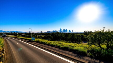 Obraz premium Sunny Road Trip to City Skyline View