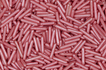 Pink Metallic Rod-Shaped Sugar Sprinkles Pattern: Macro Photography of Decorative Confectionery Elements for Baking and Cake Design