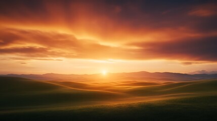 Fototapeta premium A breathtaking sunset over rolling hills, casting warm hues across the landscape.