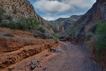 Northern Kyrgyzstan. Picturesque winding trails of the Kok Moinok canyons with red-brown rock along the Chu River.