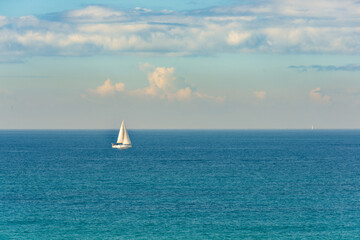 Sailing sailboat at Mediterranean sea in the morning.