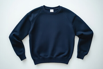 A simple navy blue crewneck sweatshirt lying flat on a clean white surface