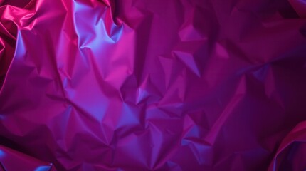 Close-up of vibrant purple fabric with a gradient of blue, showing wrinkles and rich texture.  Ideal for design backgrounds.