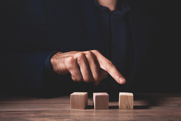 man hand holding a wooden block