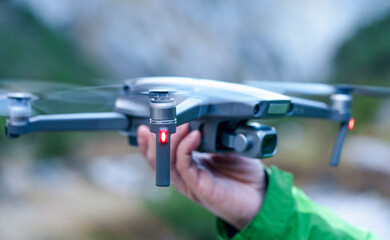 drone in hand, ready to land