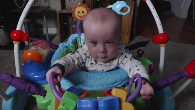 Closup of Baby Playing in Baby Seat